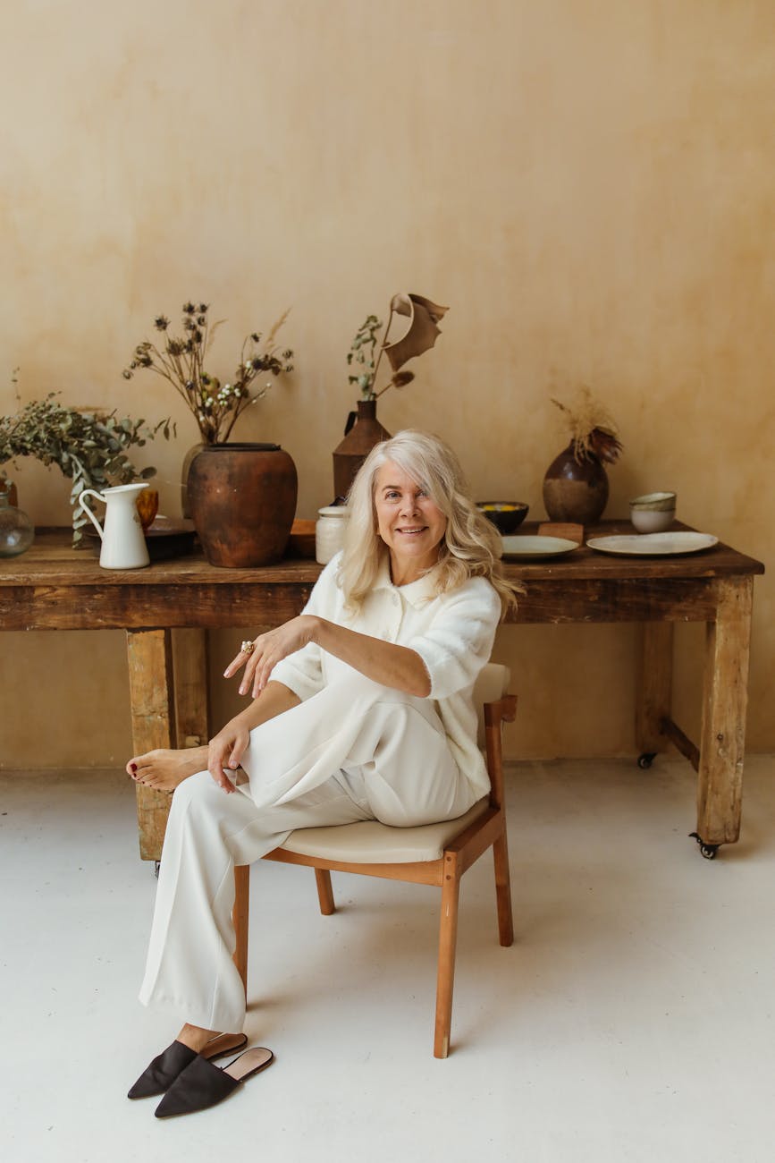 Portrait of a smiling mature woman in a bright setting.